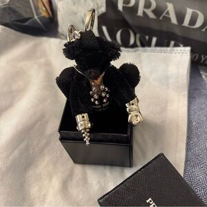 This is the cutest , (seriously), adorable PRADA teddy charm  .